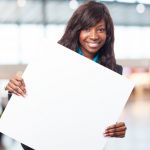 Women: Gaining More Visibility at Work happy-black-woman-with-banner_1149-1944