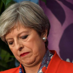 PM Theresa May eats humble pie, set to form coalition with an unknown party. Theresa May